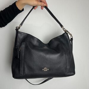 Coach Scout black pebbled leather hobo bag featuring polished pebble leather